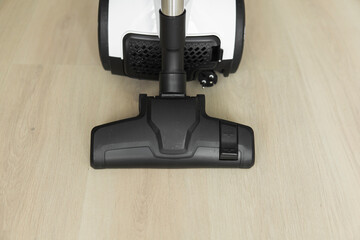 Bagless cyclone vacuum cleaner on a laminate. Electrical apparatus that by means of suction...