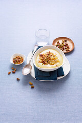 Potato soup with corn and salty pistachio crumble (ph. Marianna Franchi)