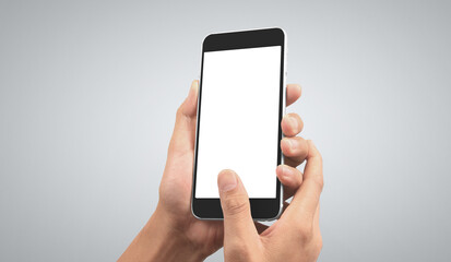 Hand holding smartphone device touching screen