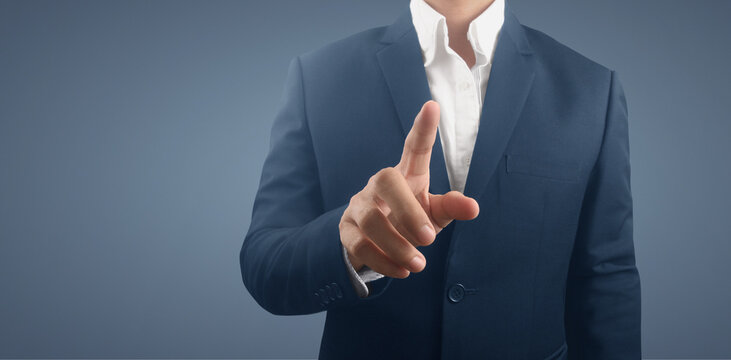Businessman pressing button virtual screen. futuristic interface