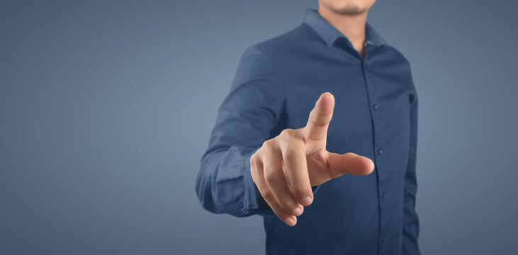 Businessman pressing button virtual screen. futuristic interface