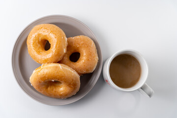 glazed donuts and coffee image. top view