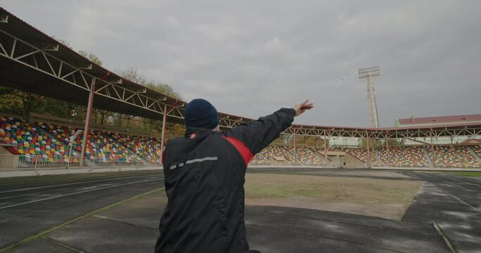 Spear throwing training Paralympian man with defective legs sitting in a wheelchair Exercise for training hands on the street outside the stadium