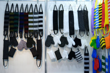 Handmade gloves and loofahs for taking steam bath hanging on the store counter