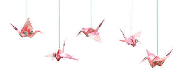Origami cranes haning with string