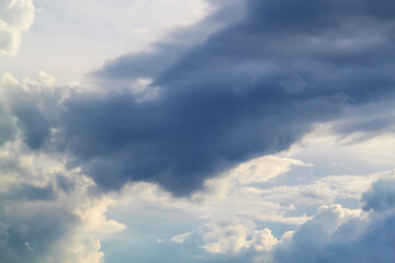stormy grey and white clouds on blue sky background