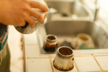 Fototapeta na wymiar Italian male making moka coffee at home