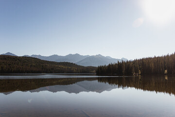 Pyramid Lake in Jasper National Park with scorching sun in the clear sky