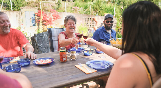 Happy Family Having Fun At Barbecue Dinner Outdoor - Multi Generational People