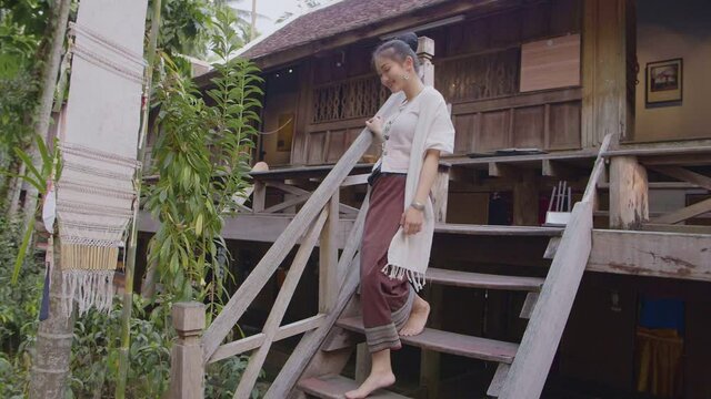 Girl In Thai Traditional Dress Walking Down Stair'S Thai House, Slow Motion
