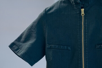 Closeup shot of denim dress with zipper at the back © Wirestock Exclusives