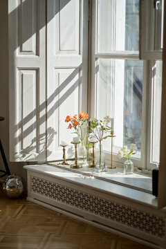 Flowers at the open window in tht living room