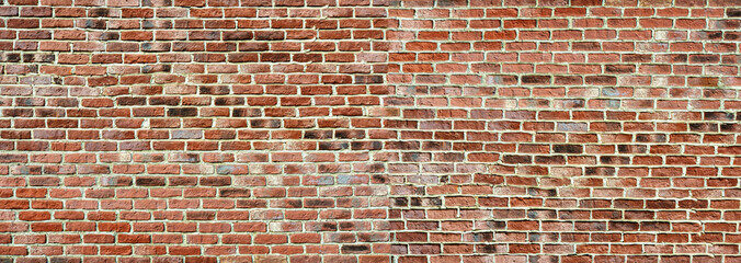 Panoramic rugged old red brown bricks wall. texture background