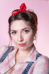 Pin up woman close up portrait on pink background