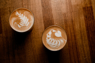 Top view of glasses of coffee with latte art with beautiful coffee milk foam