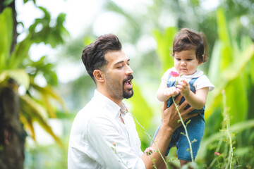 Naklejka premium family of child baby and father, man parent raising and playing with son, home, adult father and a little boy person are happy at home, cheerful childhood lifestyle together