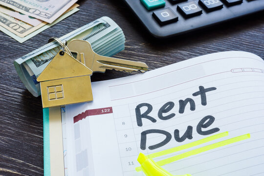 Rent due sign in the planner and key.