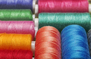  Colored threads on bobbins blue, green ,red.
