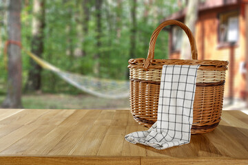 Wooden picnic basket of free space and summer landscape. 