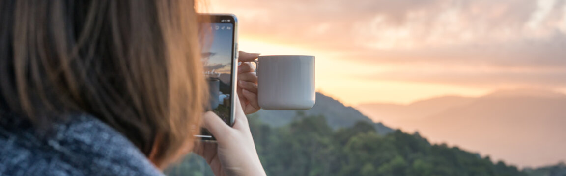 web banner solo woman use phone take photo during drink coffee with relax and wellbeing feel with mountain background