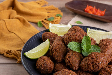 Traditional Arabian fried snack made with wheat and stuffed with minced meat. Quibe