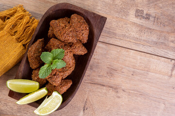 Traditional Arabian fried snack made with wheat and stuffed with minced meat. Quibe