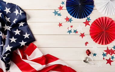 Decorations for 4th July, Independence Day USA. Paper fans, national flag, stars and noisemakers on...