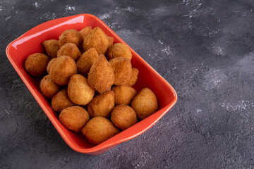 Traditional Brazilian fried snack stuffed with chicken . Coxinha de frango