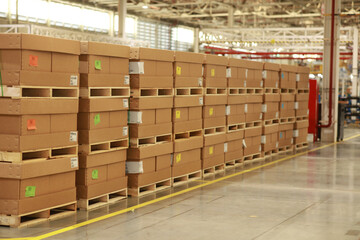 stack of cargo on pallet , Line of brown carton on ballet arrange in warehouse