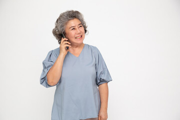 Senior Asian woman talking on her mobile phone isolated on white background, Conversation on telephone concept