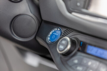 Fototapeta na wymiar close-up of keyless car ignition button, hybrid vehicle