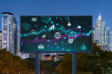Research and technological development glowing icons on billboard. Night panoramic city view of Bangkok. Concept of innovative activities expanding new services or products in Southeast Asia.