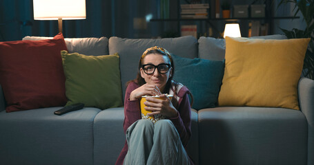 Cheerful woman watching her favorite series