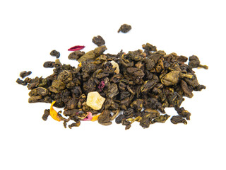 Aromatic green dried tea leaves with mango isolated on the white background