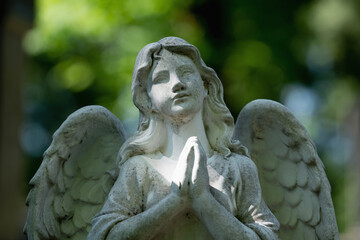 Tender beautiful angel praying. Fragment of an  ancient statue. Faith, religion, death,...