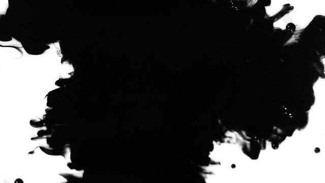 Super Slow Motion Shot of Black Ink Drop Isolated on White Background at 1000 fps.