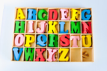Alphabet Letters  in different colors for decoration of kids in wood box.