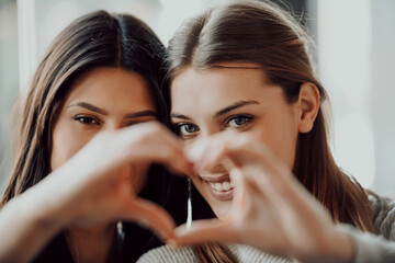 Diverse friends girls lesbian couple hugging. Stylish cool generation z women dating in love enjoy...