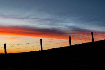 sunset over the fence