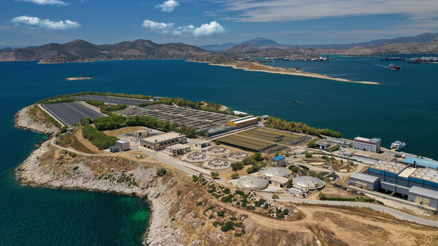Aerial drone photo of latest technology sewage and sludge processing plant in small island of Psitalia or Psyttaleia, Piraeus, Attica, Greece