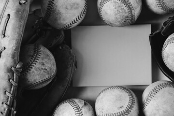 Old grunge texture of baseballs and glove in flat lay with copy space on note card.