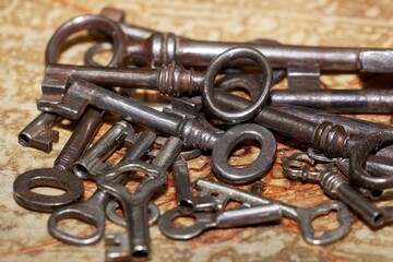 Old keys on a brown background