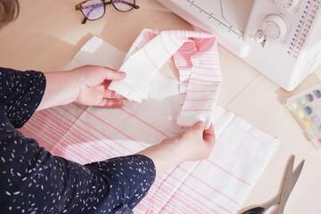 Obraz na płótnie Canvas fabric shopper cutting process, eco cotton shopping bag, sew bag on sewing machine, zero waste lifestyle concept