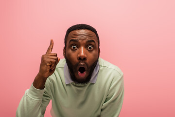 Astonished african american man having idea isolated on pink