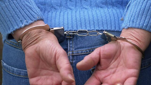 Convict arrested wearing handcuffs behind back