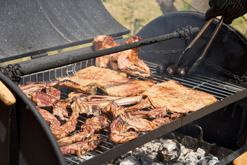 cooking on a charcoal and wood barbecue