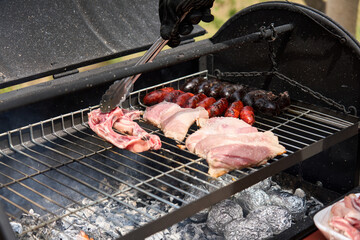 cooking on a charcoal and wood barbecue
