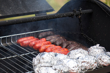 cooking on a charcoal and wood barbecue