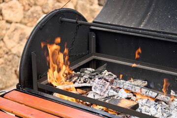 excellent portable barbecue made by hand in black.