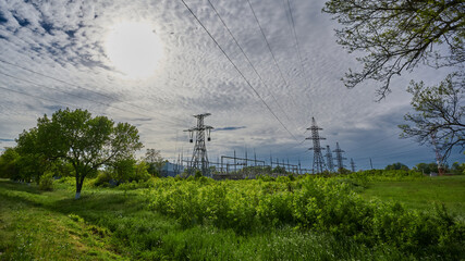 power station against the backdrop of greenery during the day
